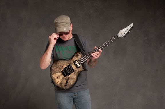 Chris Poland with his signature Legator CP6 guitar